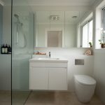 Modern bathroom with a shower, sink and toilet