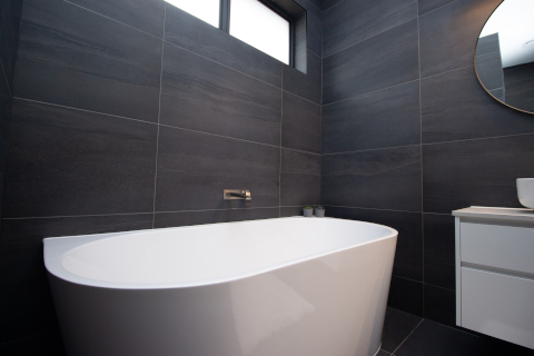 Black tiled bathroom bathtub
