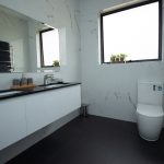 Bathroom with two sinks and toilet