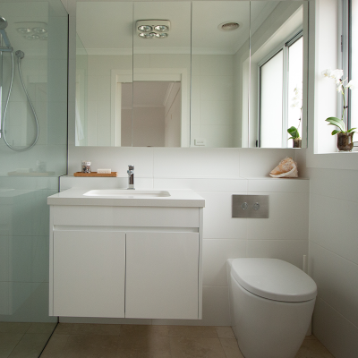 11 Bathroom with floating sink next to toilet
