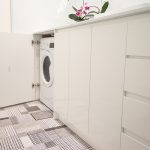 Bathroom with under cupboard washing machine