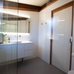 White tiled walls and stone tiled floors