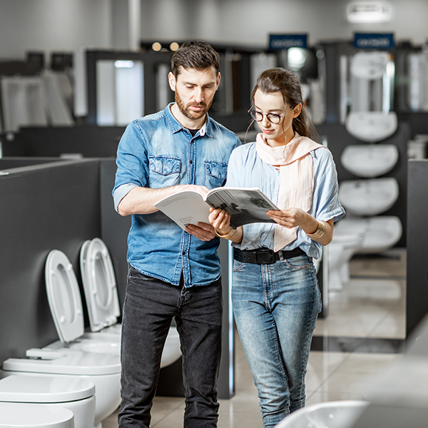Couple choosing a toilet