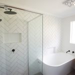 White bathroom with wooden accents