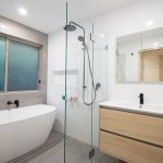 Tiled bathroom with wooden accents