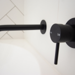 Black bath tap and handle